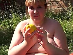 jaw-dropping plumper in the garden, pushes a lemon out of a thick hairy pussy
